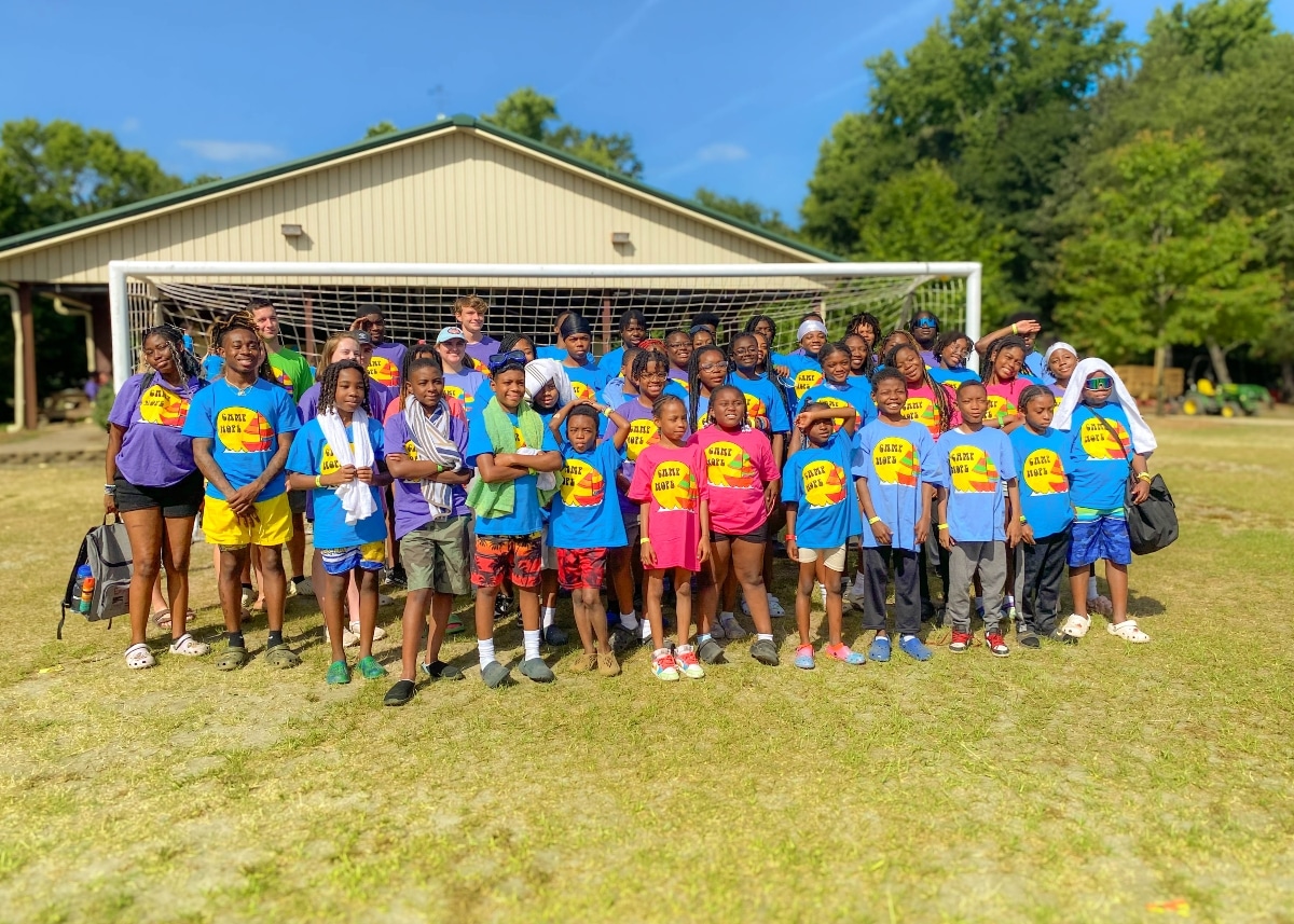 Children at Camp Hope pose for a photo during a day at the site.