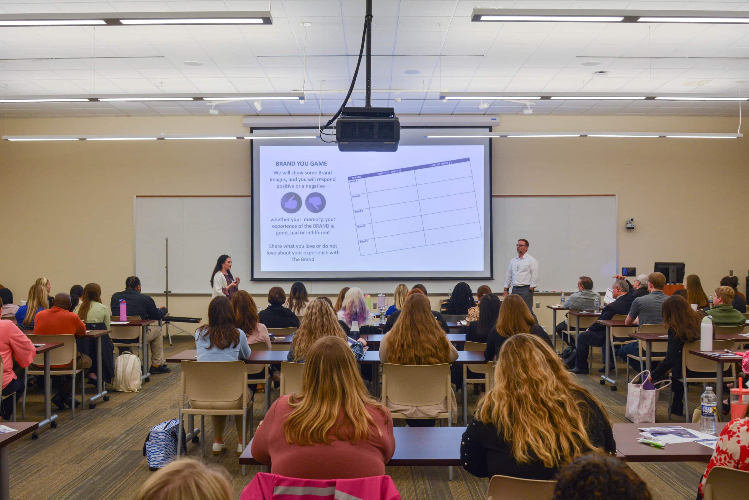 New ECU Health team members sit together during orientation in Greenville.