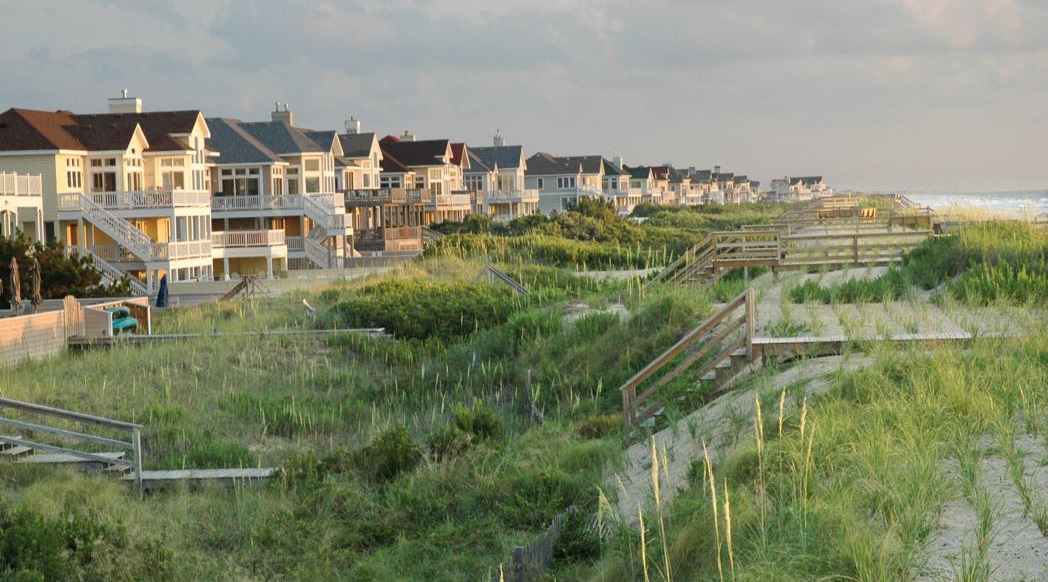 A row of beach houses sit facing the ocean on North Carolina's outer banks.