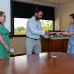 Dr. Niti Armistead hands a Board Quality Leadership Award to a team member at ECU Health.