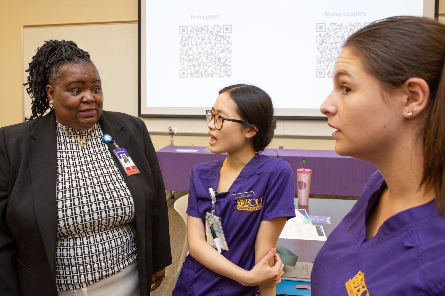 Attendees talk following the ECU Health nurse extern graduation in July of 2024.