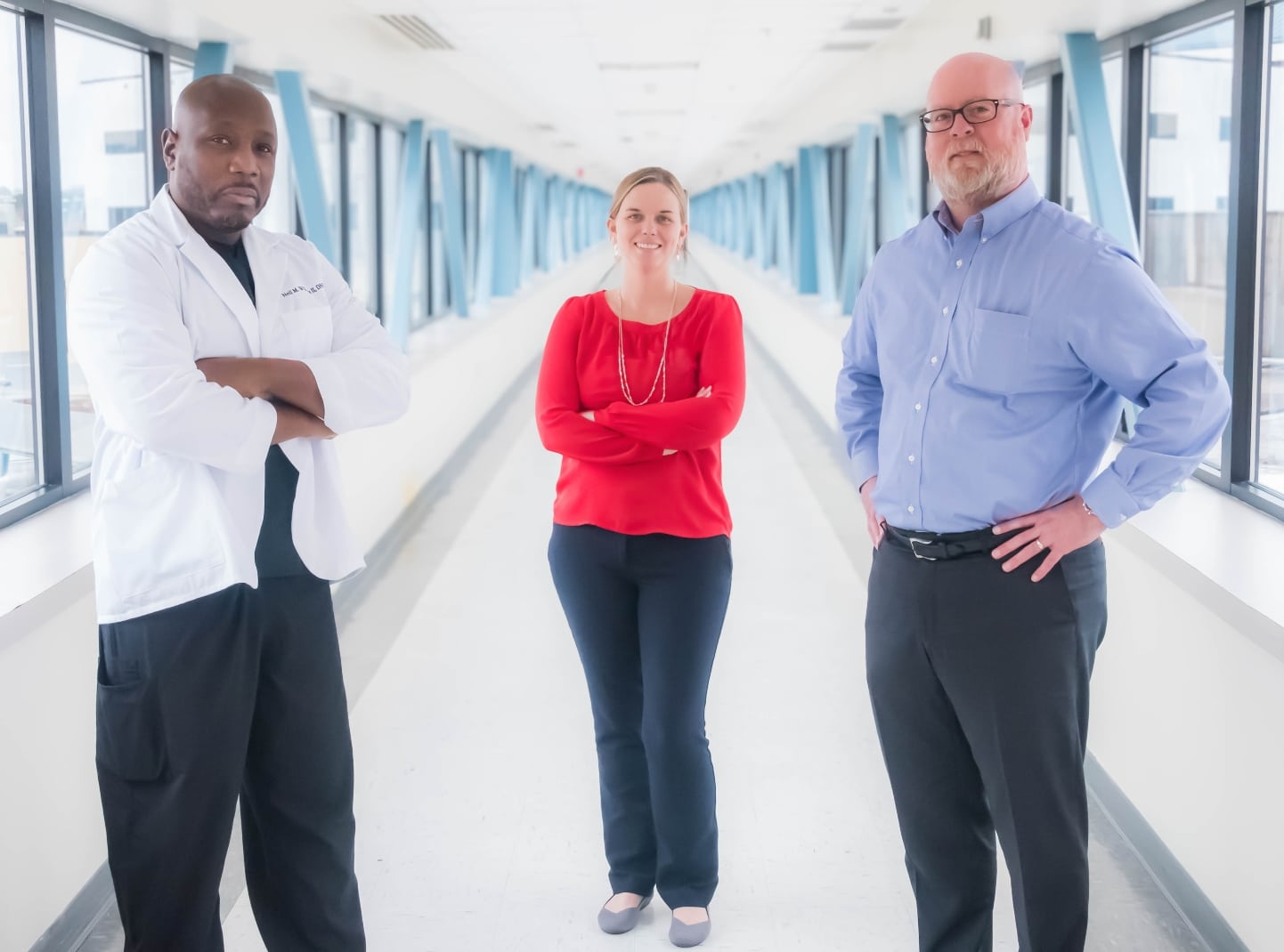 ECU Health team members stand on the sky bridge at ECU Health Medical Center.