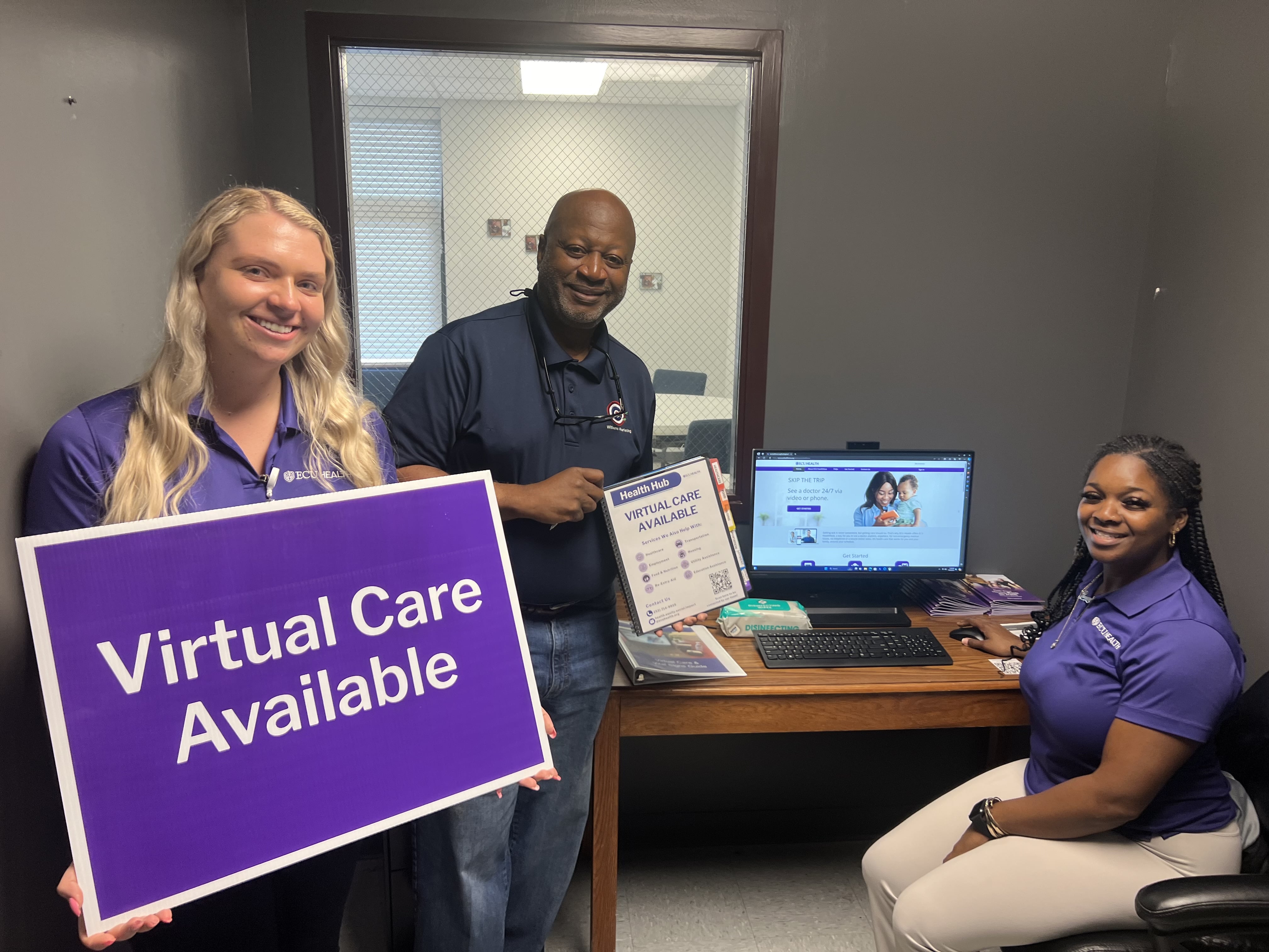 ECU Health team members pose for a photo featuring the system's Health Hubs.