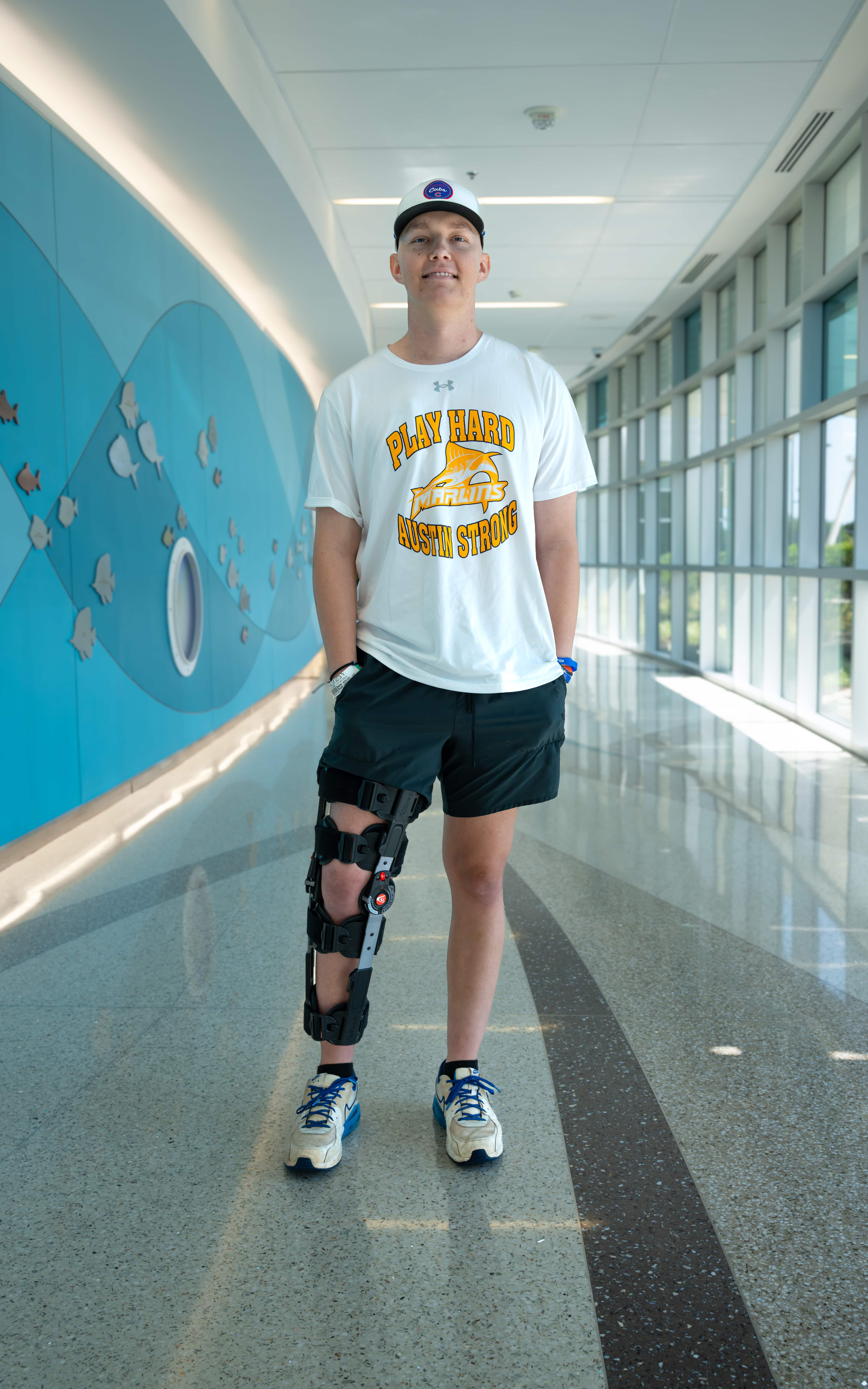 Austin Cherry stands in a hallway at Maynard Children's Hospital.