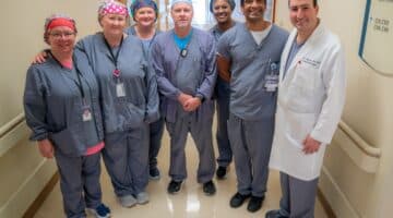 Dr. John Cantanzaro and team pose for a photo at ECU Health Medical Center.