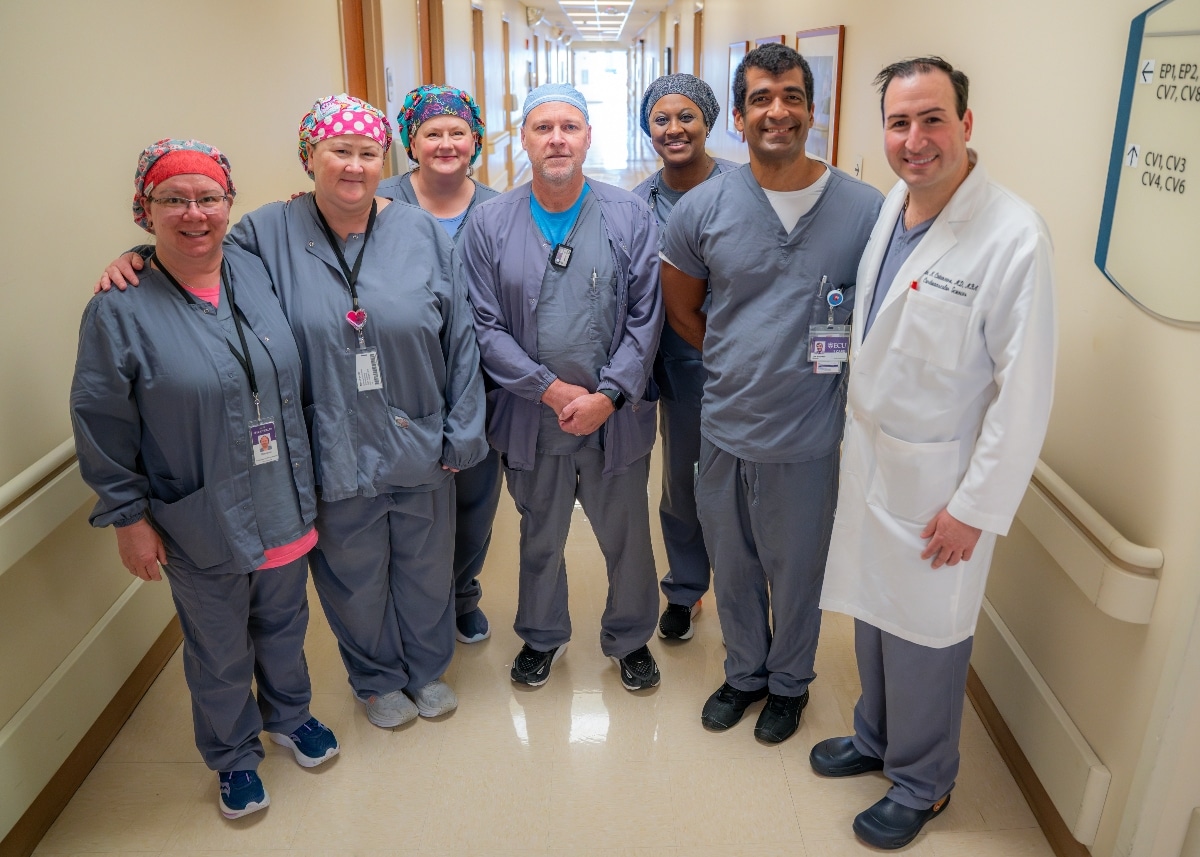 Dr. John Cantanzaro and team pose for a photo at ECU Health Medical Center.