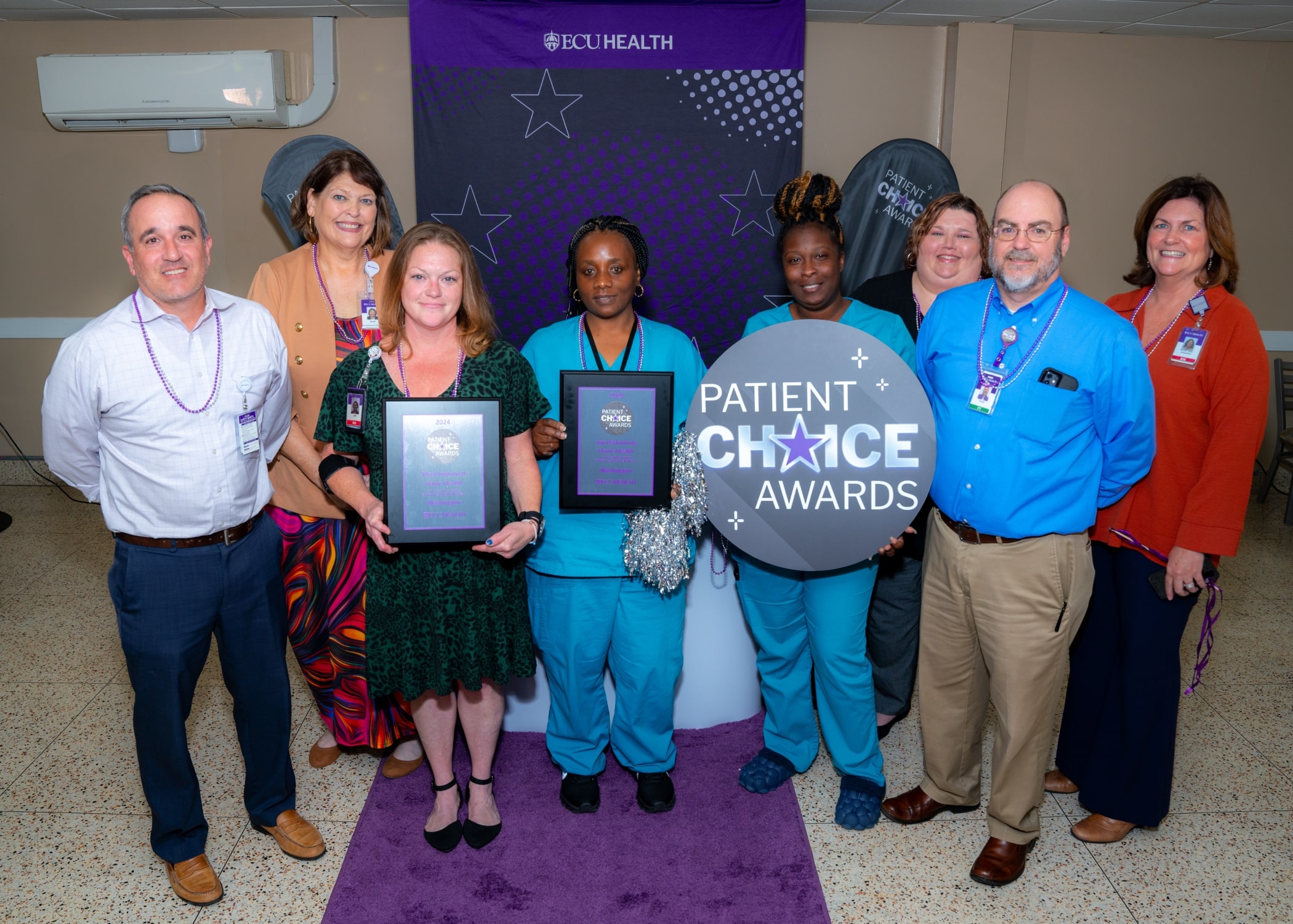 Team members from ECU Health Home Health – Washington gather for a celebration to recognize their two Patient Choice Award wins for Top Performing Home Health for Create a Caring Environment that Helps Heal and ​Most Improved Home Health for Create a Caring Environment that Helps Heal.