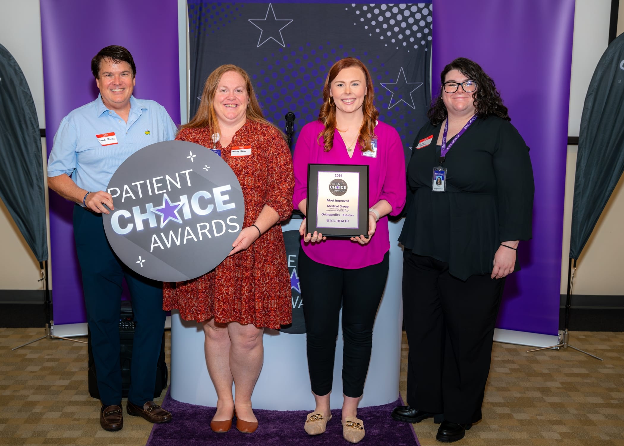 Team members from ECU Health Orthopedics – Kinston come together for a photo to recognize winning the Patient Choice Award for Most Improved Medical Group for Create a Caring Environment that Helps Heal.