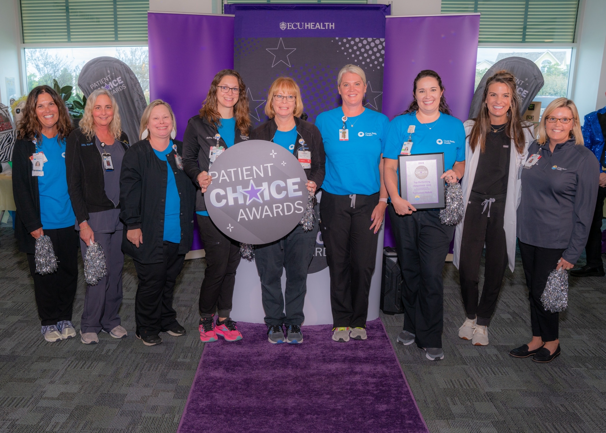 The Outer Banks Health Hospital – Pulmonary Rehab team takes a photo as they celebrate their Patient Choice Award for Top Performing Outpatient Unit for Create a Caring Environment that Helps Heal.