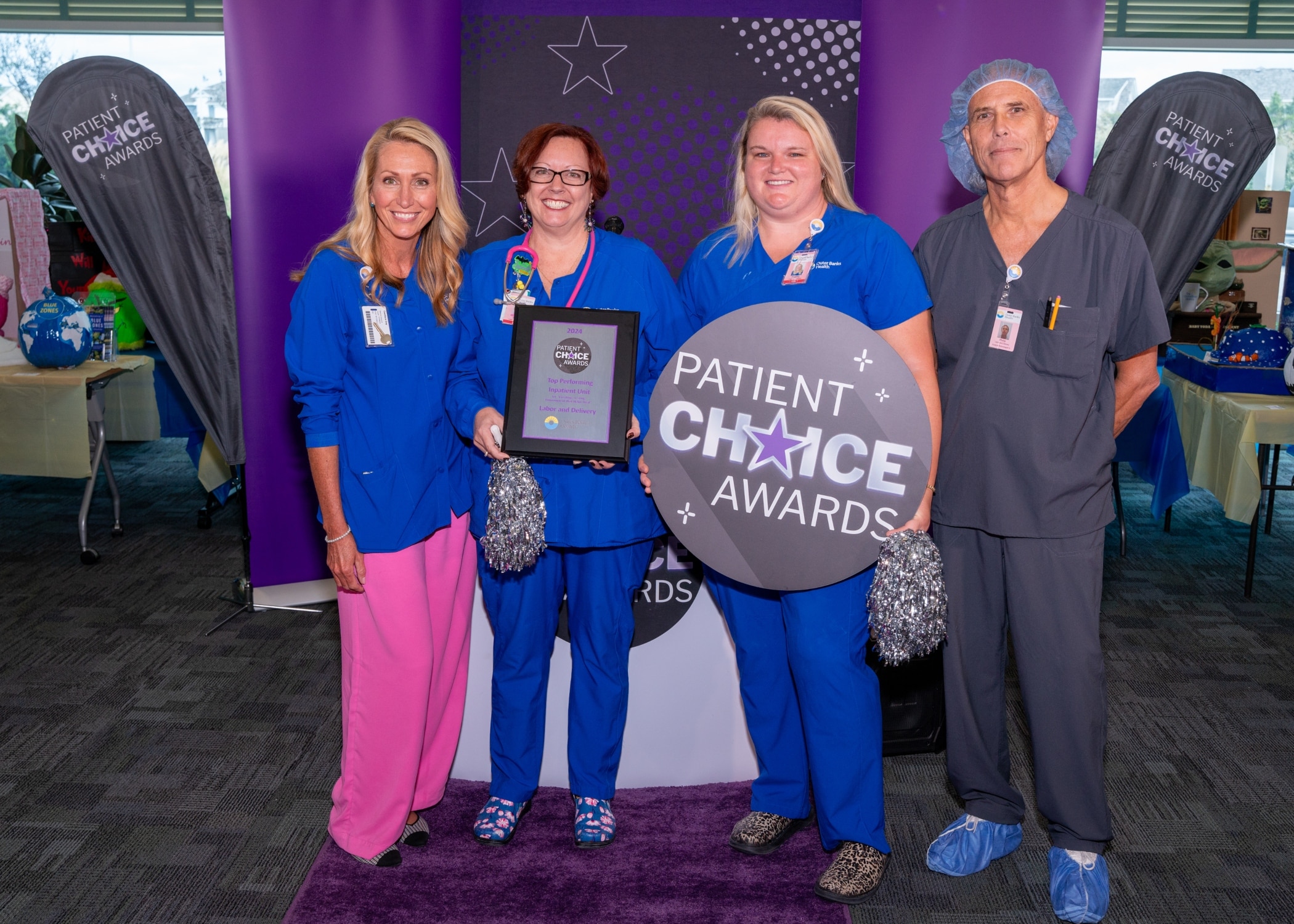 The team from Outer Banks Health Hospital – Labor & Delivery takes a photo to recognize winning the Patient Choice Award for Top Performing Inpatient Unit for Create a Caring Environment that Helps Heal.