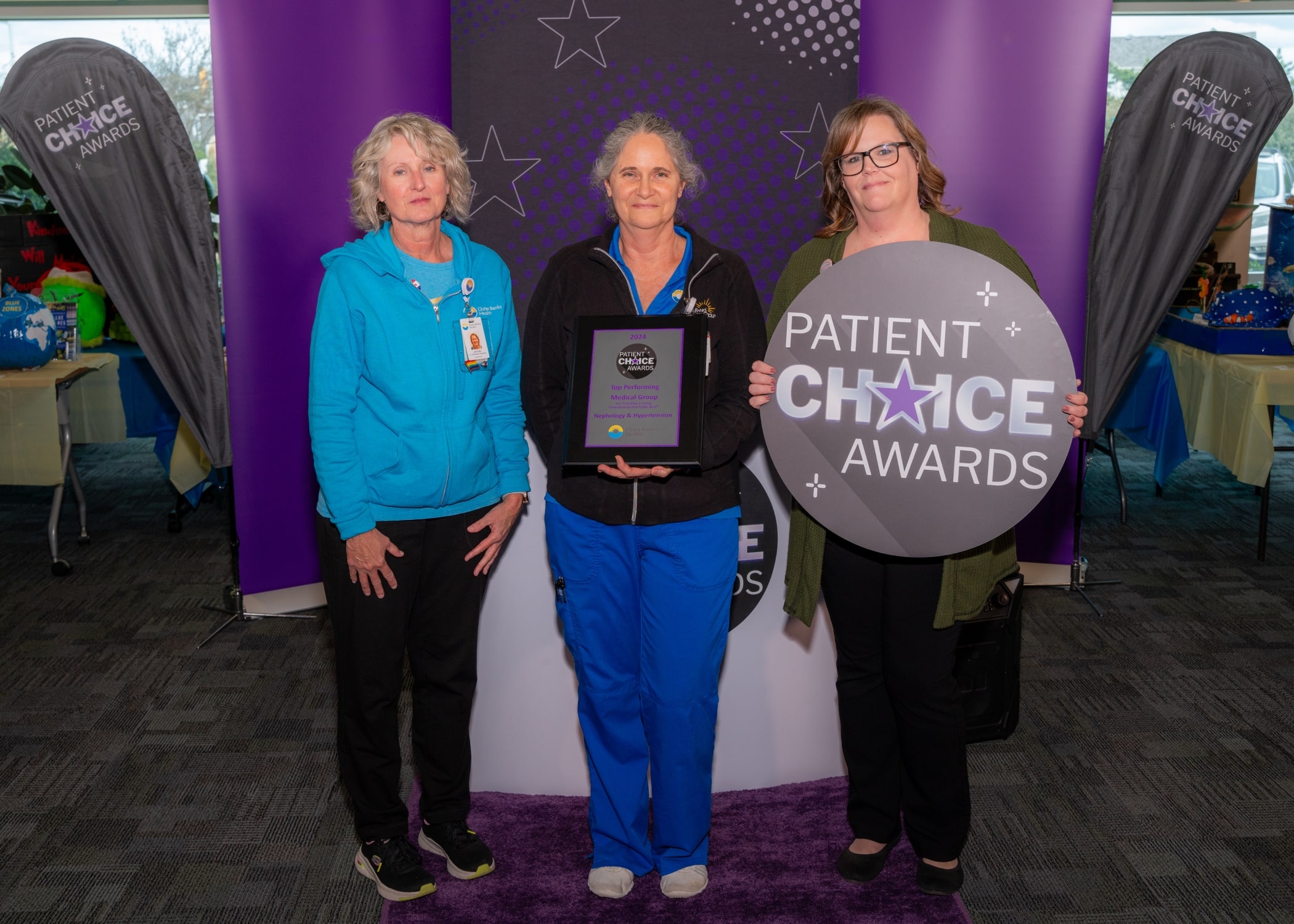 The team from Outer Banks Health Hospital – Nephrology & Hypertension​ gathers for a photo to recognize their Patient Choice Award for Top Performing Medical Group for Create a Caring Environment that Helps Heal.