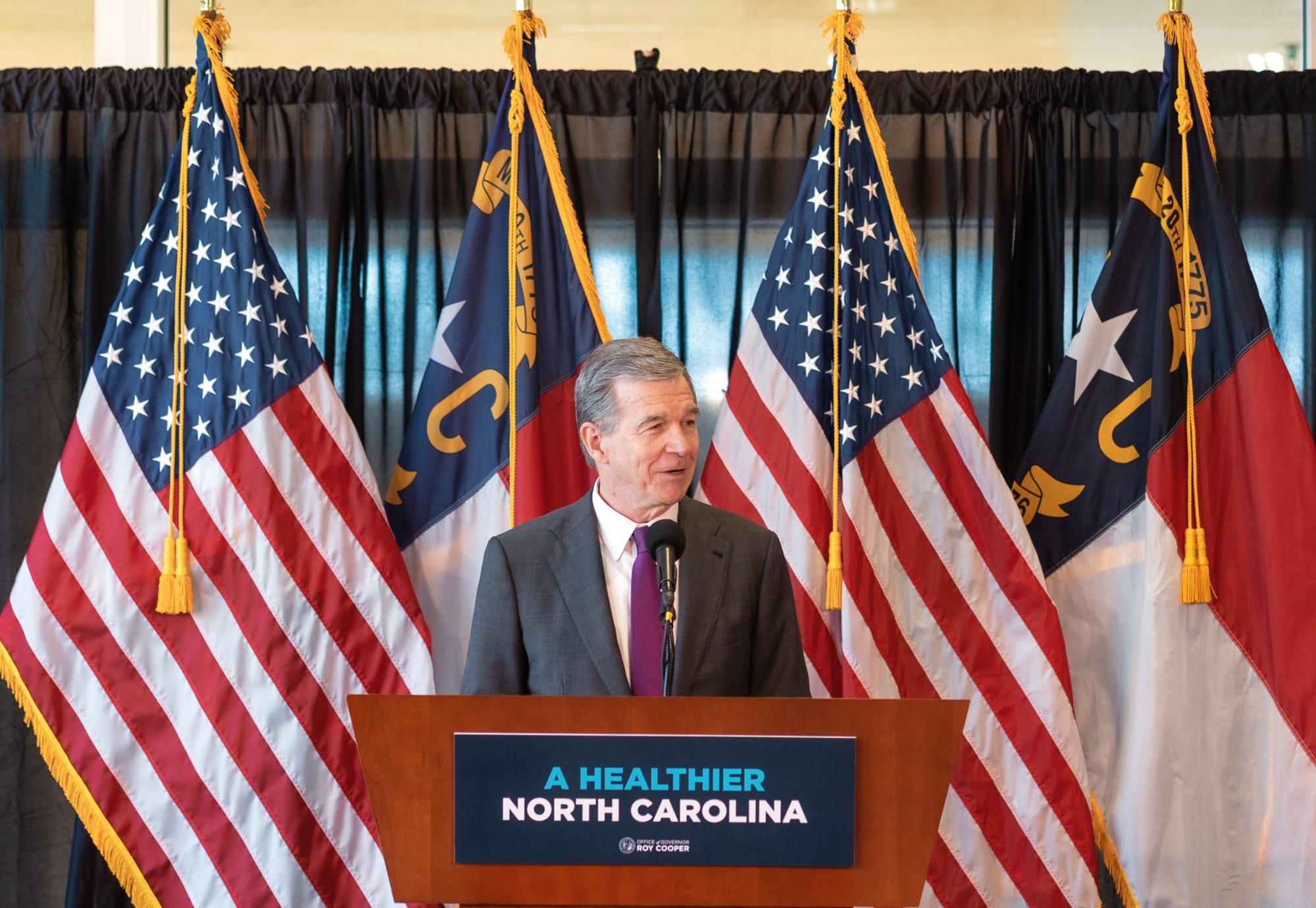 North Carolina Gov. Roy Cooper speaks during a one-year anniversary celebration for Medicaid expansion in North Carolina.