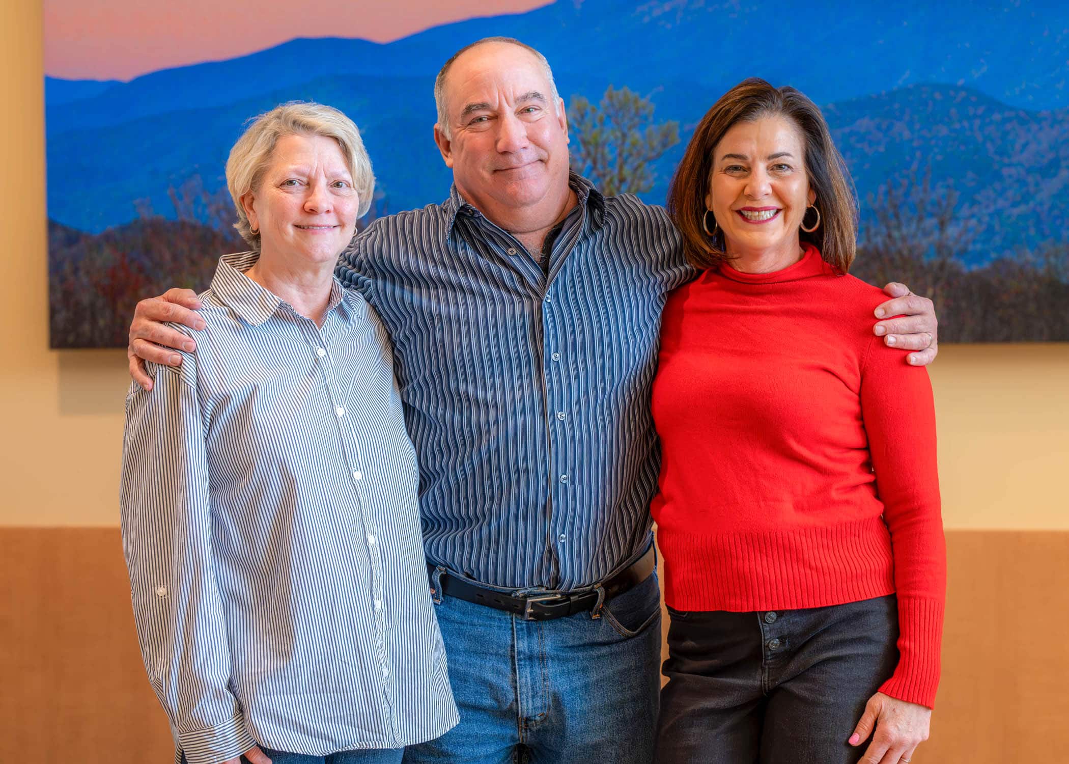 Tony Parker, center, stands with his wife, Delia, left, and ECU Health team member Vicky Greco, right.