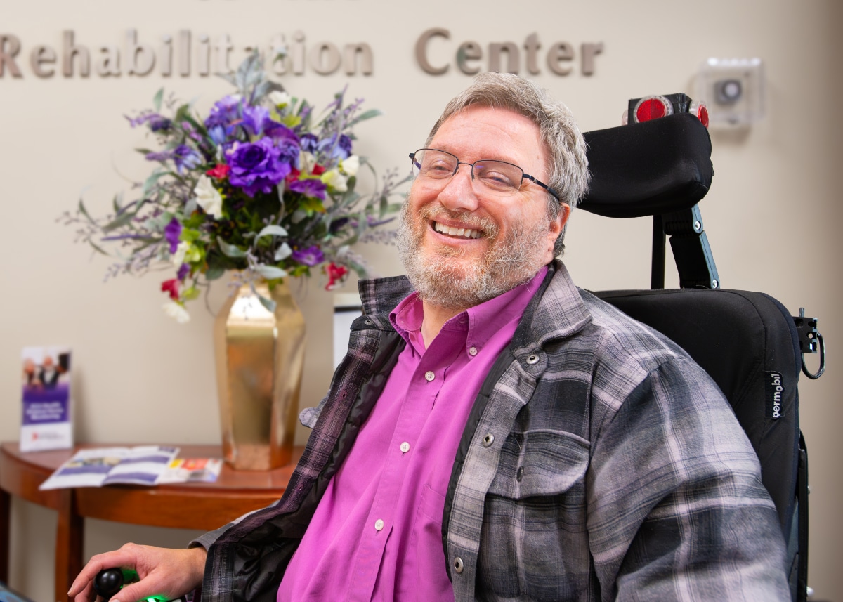 Jaimie Yahnker poses for a photo at the Rehabilitation Center at ECU Health Medical Center, where his is a team member.