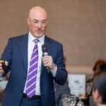 ECU Health COO Brian Floyd speaks to a crowd during a Greenville-Pitt County Chamber of Commerce Power Luncheon in February 2025.