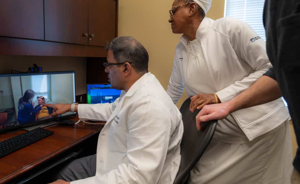 Dr. Sivakumar Ardhanari, cardiologist, ECU Health, and Maxine Shepherd, nurse, ECU Health, treat a patient from Edenton, North Carolina, virtually.