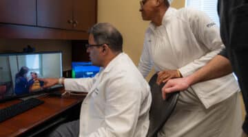 Dr. Sivakumar Ardhanari, cardiologist, ECU Health, and Maxine Shepherd, nurse, ECU Health, treat a patient from Edenton, North Carolina, virtually.